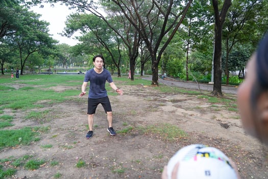 Male and female soccer players practice using the ball in the park field diligently and happily. photo