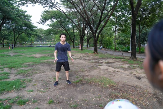 Male and female soccer players practice using the ball in the park field diligently and happily. photo
