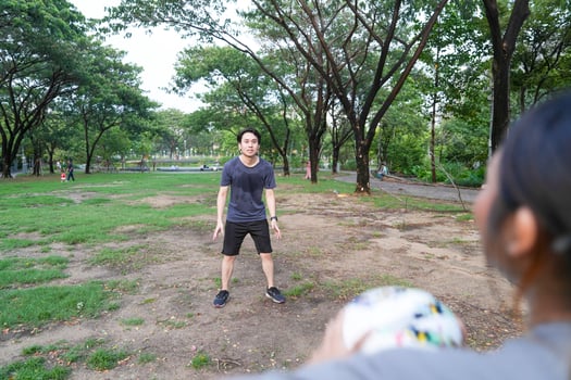 Male and female soccer players practice using the ball in the park field diligently and happily. photo