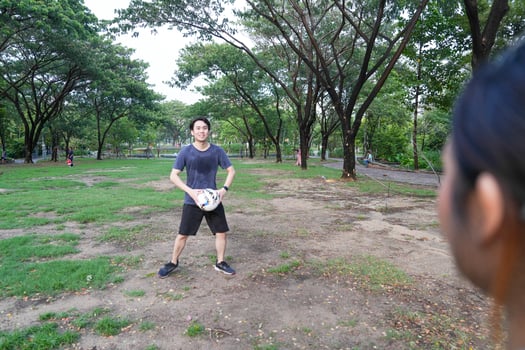 Male and female soccer players practice using the ball in the park field diligently and happily. photo