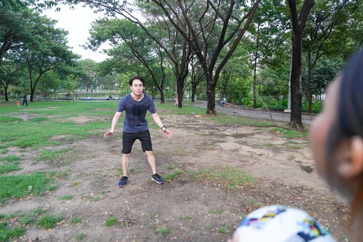 Male and female soccer players practice using the ball in the park field diligently and happily. photo