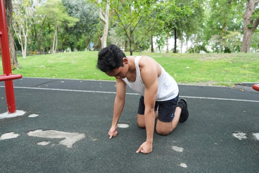 Asian man practicing gymnastics doing gymnastics bar and hoop exercises and stretching and resting for sports. photo