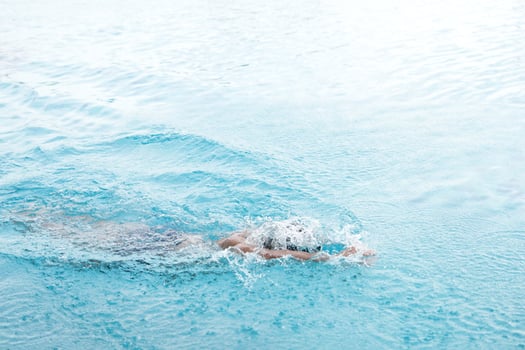Asian men practicing swimming and preparing to play water polo and stretching and resting for water sports. photo