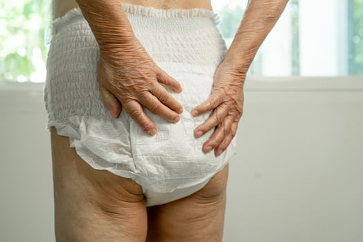Asian senior woman patient wearing incontinence diaper in hospital, healthy strong medical concept. photo