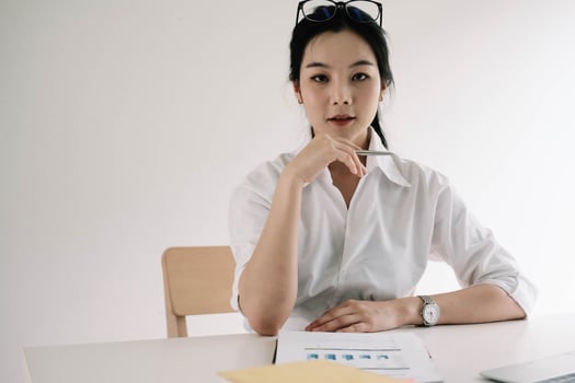 Portrait Of Attractive Asian Businesswoman Working On Laptop for marketing plan photo
