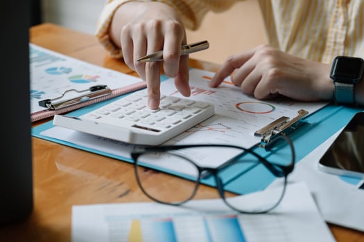 Accountant or banker calculate the financial report with calculator photo