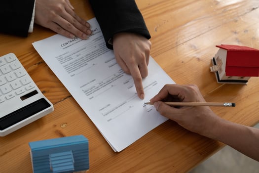 Real estate agent offer hand for customer sign agreement contract signature for buy or sell house. Real estate concept contact agreement concept photo