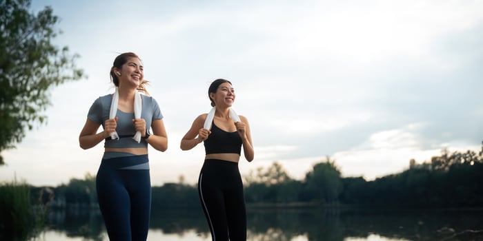 Healthy and active lifestyle, sport concept. Attractive ecstatic young sportswoman, smiling joyfully as jogging, sprinter run in park photo