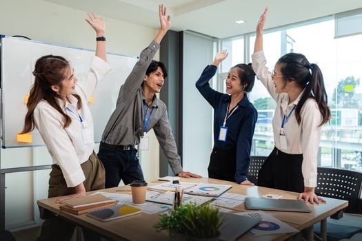 Business team celebrate corporate victory together in office, laughing and rejoicing, smiling excited employees colleague screaming with joy in office photo
