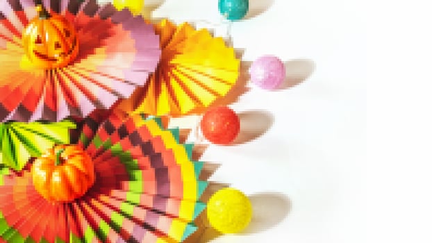 Pixel composition with colorful paper fans, decorative pumpkin, lightening and jack o'lantern photo