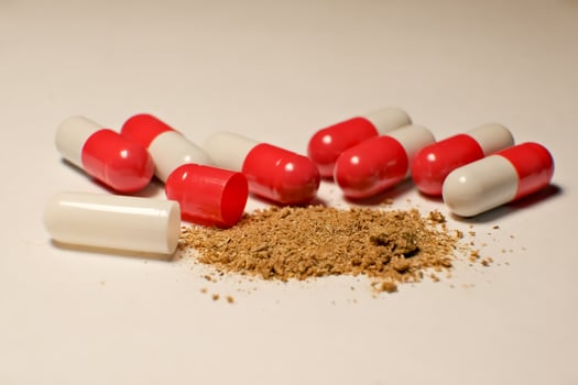 open tablet.tablet contents. white and red tablets. close-up . the concept of health, treatment. photo