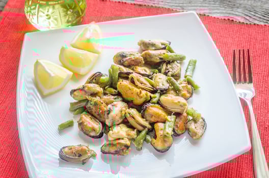 Fried mussels on the square plate photo