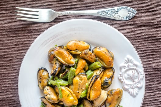 Fried mussels on the plate photo
