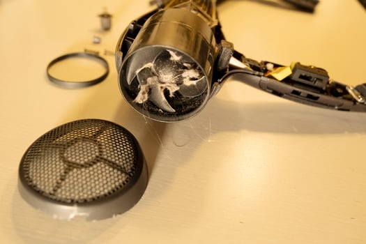 broken, burnt hair dryer. the hair dryer burned out due to dust and hair. photo