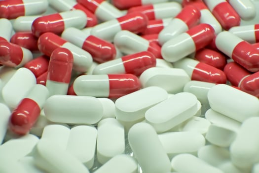 tablets . white-red tablets. close-up . the concept of health, treatment. photo