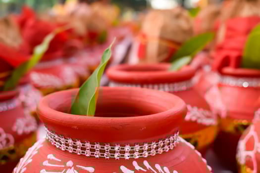 Kalash with coconut and mango leaf with floral decoration earthen pots containing sacred water. Kalash for hindu puja during Jagannath Temple Mangal Kalash Yatra, front view, closeup photo