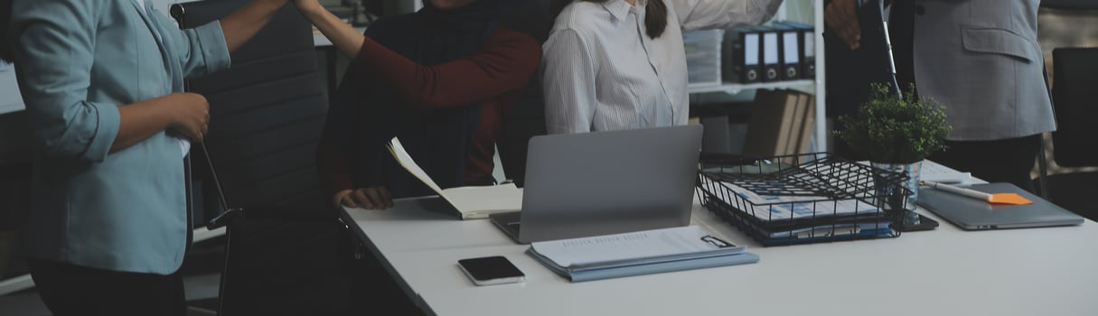 Financial analysts analyze business financial reports on a digital tablet planning investment project during a discussion at a meeting of corporate showing the results of their successful teamwork. photo