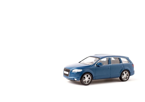 Blue iron toy car on a white background. SUV. copy space. sport utility vehicle photo