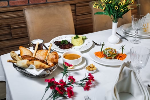 White Table With Platters of Food photo