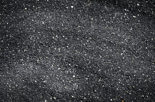 Close-up of black sand texture background. photo