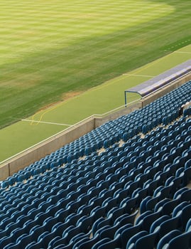 Empty Plastic Chairs In The Stands Of Football Stadium photo