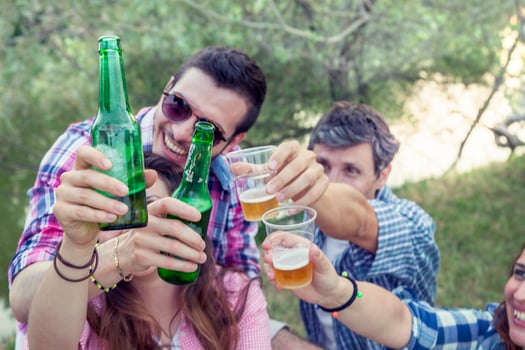 Happy group of young friends toasting with beer photo