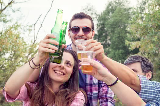 Happy group of young friends toasting with beer photo