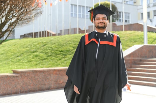 education, graduation and people concept - happy Indian Male graduate student photo