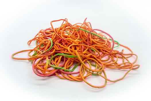 a bunch of messy rubber bands on a white background photo