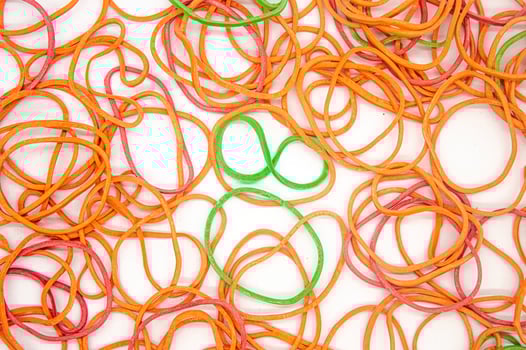 a bunch of messy rubber bands on a white background photo