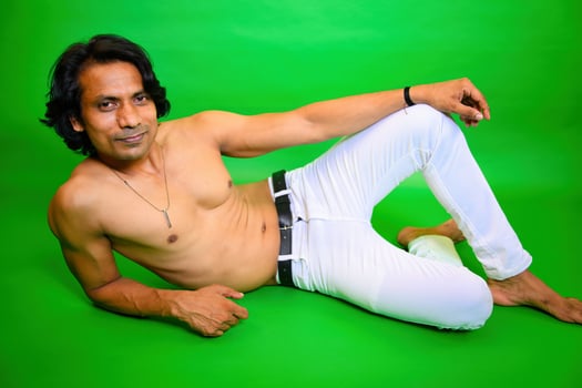 Shirtless man lying on floor photo