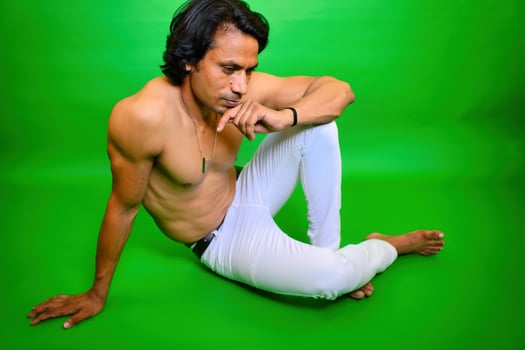 Thoughtfully Shirtless man sitting on floor photo