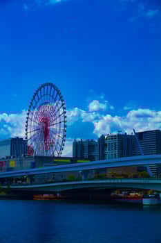 A ferris wheel at the amusement park in Odaiba Tokyo daytime photo