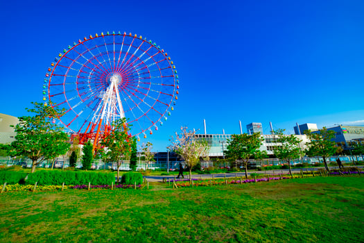 A ferris wheel at the amusement park in Odaiba Tokyo daytime wide shot photo