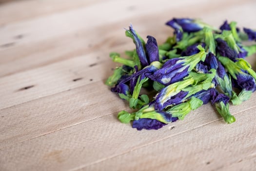 Butterfly pea, Blue pea dried flower Clitoria ternatea L on wood table photo