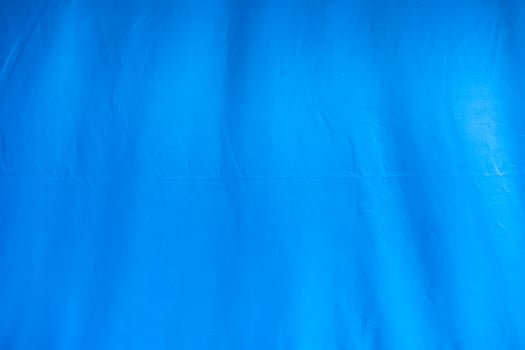 Blue tent canvas with furrow background photo