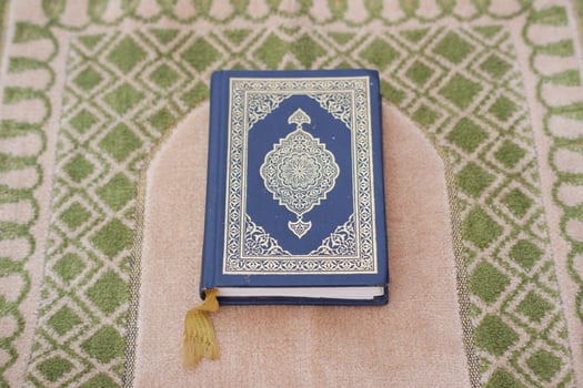 Holy Quran on green background, Ramadan Kareem photo