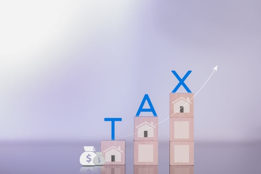 financial research government taxes and tax return calculation concepts Businessmen showing taxes on real estate Ideas for filling out online tax return forms for payments online photo