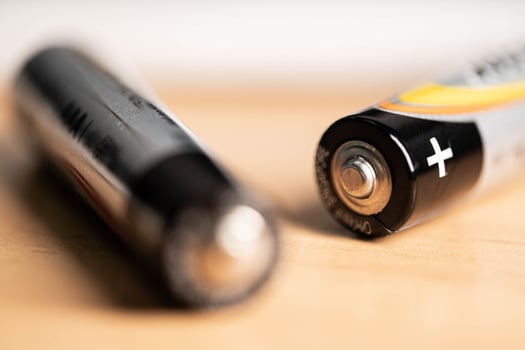 closeup of golden and silver aa alkaline batteries photo