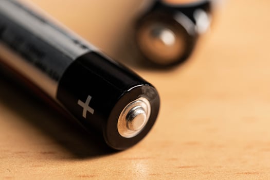 closeup of golden and silver aa alkaline batteries photo