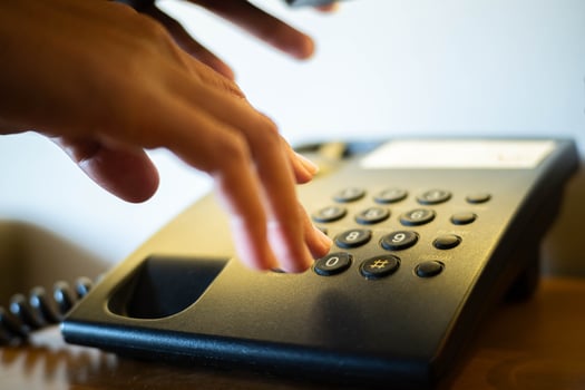 Hand Dialing on Sleek Office Telephone photo