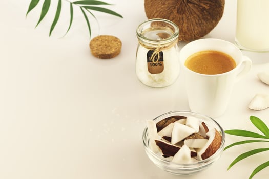 Food composition with cup of espresso and coconut products photo