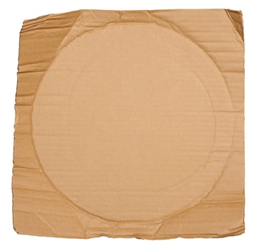 Piece of brown cardboard with torn edges on isolated background photo