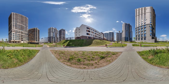 hdri 360 panorama near skyscraper multistory buildings of modern residential quarter complex in full equirectangular seamless spherical projection photo