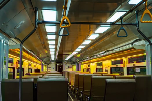 Public trains in Java, Indonesia are empty of passengers in the afternoon when the sun sets. The train carriage was quiet and many passenger seats were empty photo