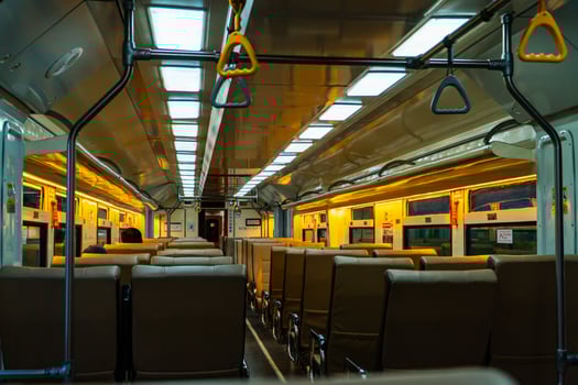 Public trains in Java, Indonesia are empty of passengers in the afternoon when the sun sets. The train carriage was quiet and many passenger seats were empty photo