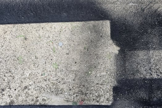 Black Grunge Painting on Concrete Wall Background photo