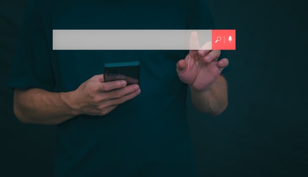 Information search technology, search engine optimization, male hand using a smartphone to search information, using the search bar function on your website photo