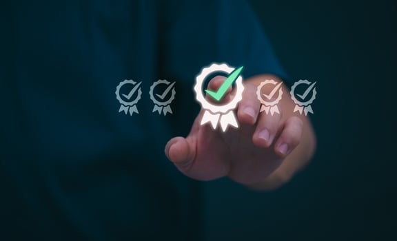 Male hand pointing at symbol of guarantee of quality of service Certification concept and standard quality control Standard warranty Documents certified on virtual screen photo