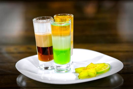 Glasses of cocktails on bar background photo